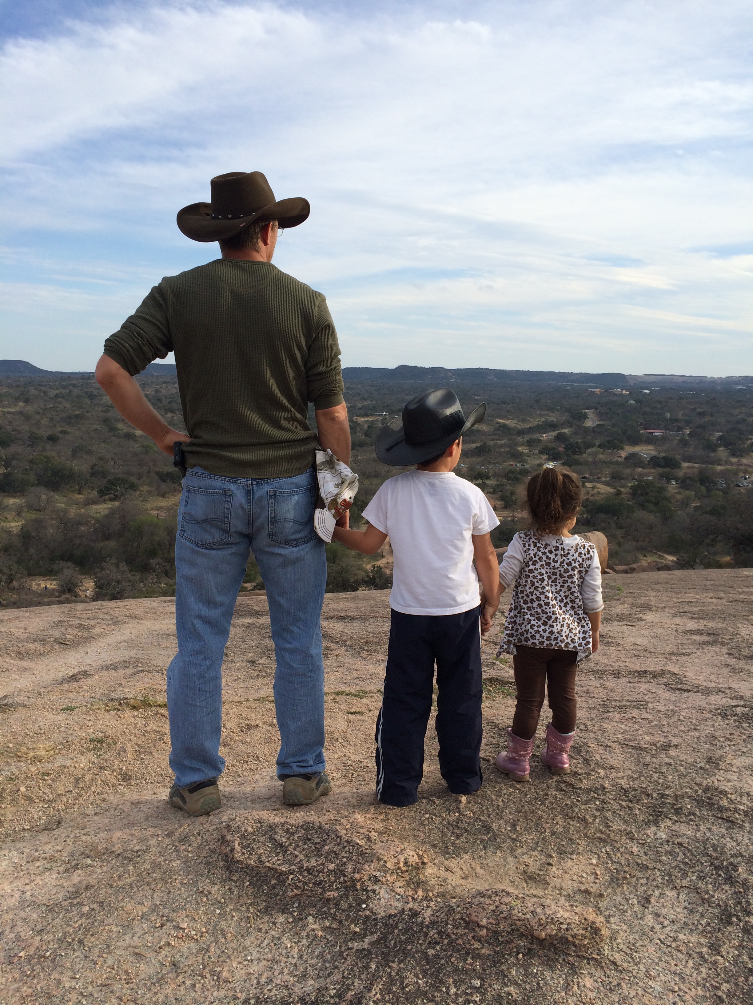 Brandon Riggs with his children overlooking the Texas Hill Country